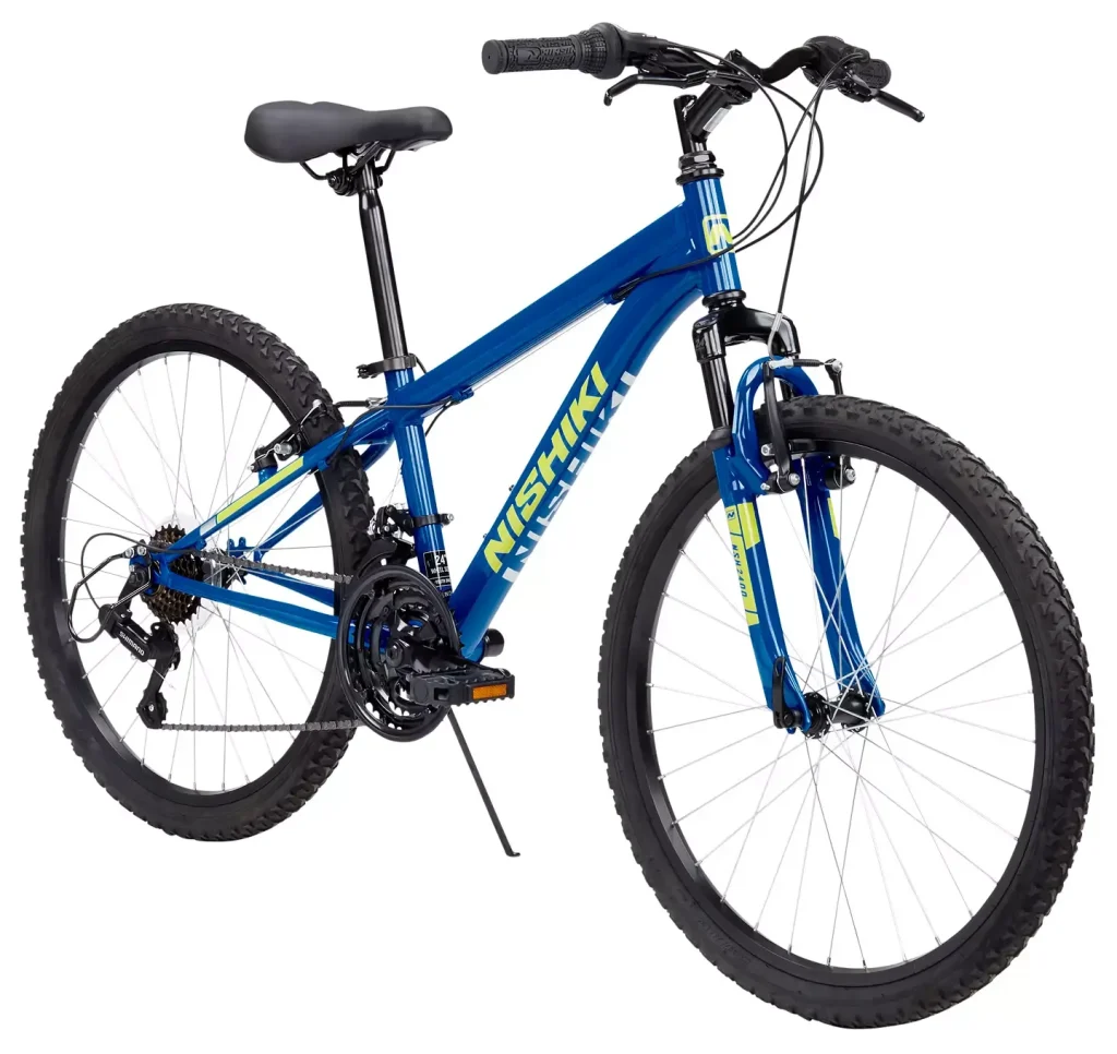 Nishiki Boys Pueblo 1.1 24-inch mountain bike with aluminum frame, 21-speed Shimano drivetrain, and knobby tires for trail riding.